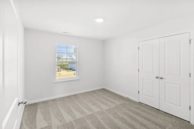 an empty room with windows