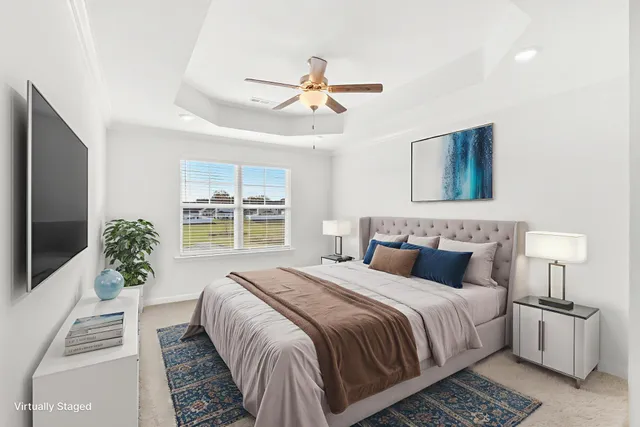 a bedroom with bed and a window