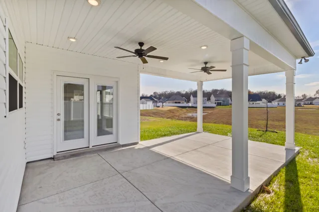 a view of a room with a flat screen tv and a floor to ceiling window