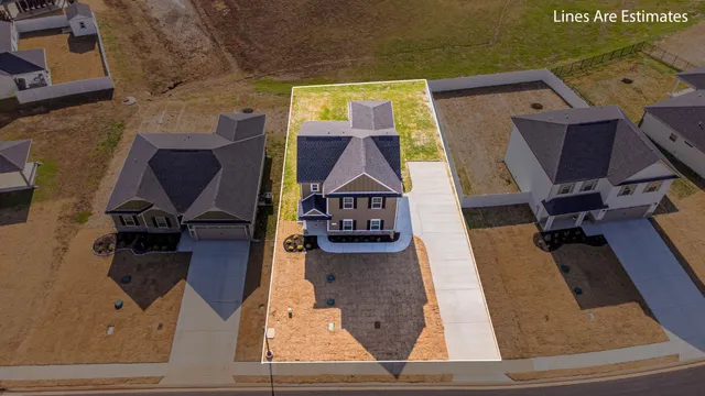 an aerial view of a house with a flat screen tv