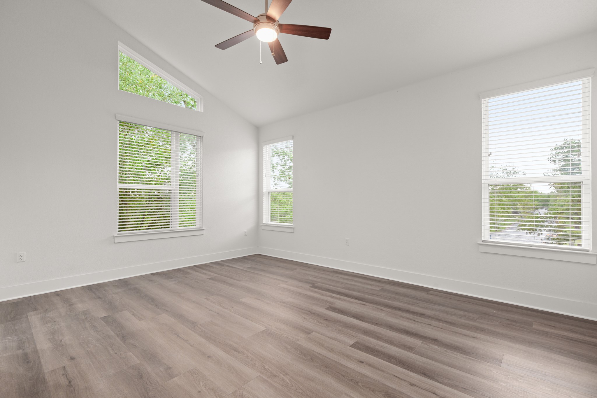 8922 Manchaca Road, Unit 701 Austin, TX 78748 - Photo 19 of 25 a view of an empty room with wooden floor and a window