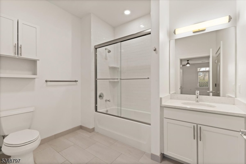 450 Springfield Avenue, Unit 301 Berkeley Heights, NJ 07922 - Photo 14 of 26 a bathroom with a sink and a mirror