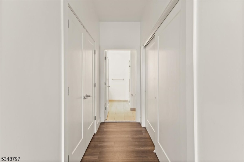 450 Springfield Avenue, Unit 301 Berkeley Heights, NJ 07922 - Photo 15 of 26 a view of a hallway with the wooden floor