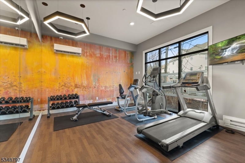 450 Springfield Avenue, Unit 301 Berkeley Heights, NJ 07922 - Photo 21 of 26 a view of a room with gym equipment