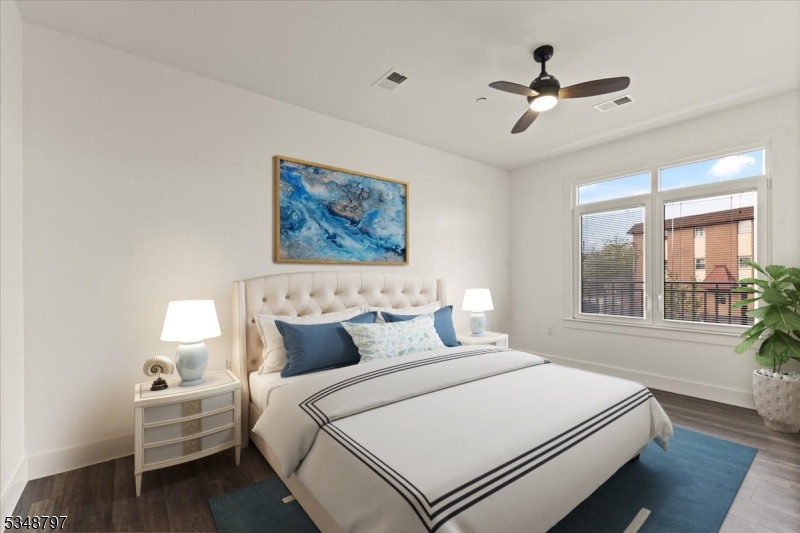 450 Springfield Avenue, Unit 301 Berkeley Heights, NJ 07922 - Photo 9 of 26 a bedroom with a large bed and a window