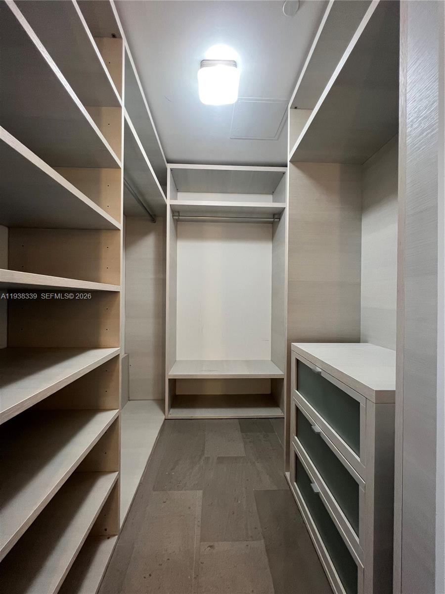 88 Southwest 7th Street, Unit 1706 Miami, FL 33130 - Photo 5 of 14 a view of an empty room with a staircase