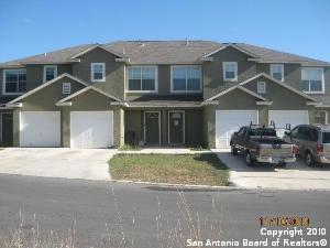 10006 Vasso View, Unit 4 Converse, TX 78109 - Photo 1 of 15 a front view of a house with a yard and garage