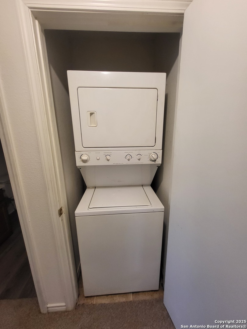 10006 Vasso View, Unit 4 Converse, TX 78109 - Photo 8 of 15 a utility room with dryer and washer