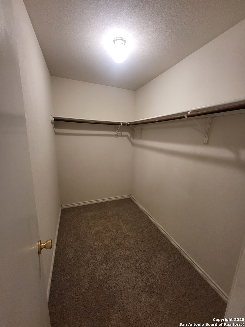 10006 Vasso View, Unit 4 Converse, TX 78109 - Photo 10 of 15 an empty room with a empty space and windows