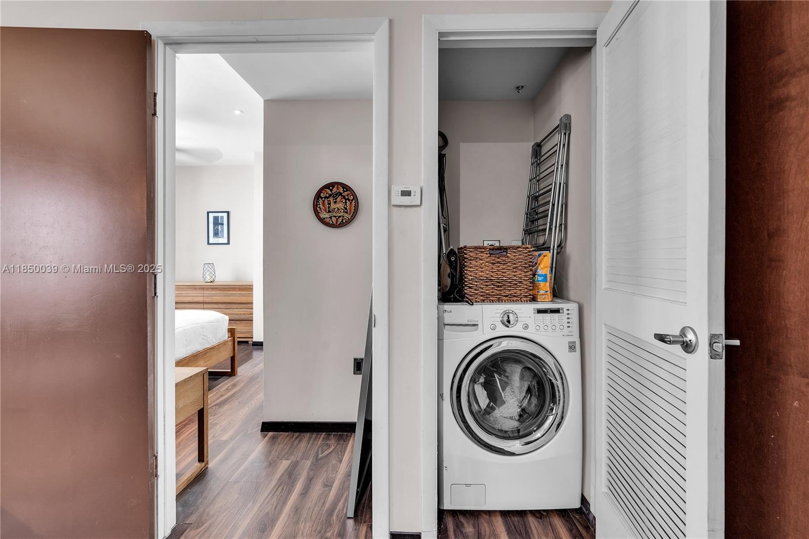 435 21st Street, Unit 322 Miami Beach, FL 33139 - Photo 13 of 41 a view of a hallway with washer and dryer