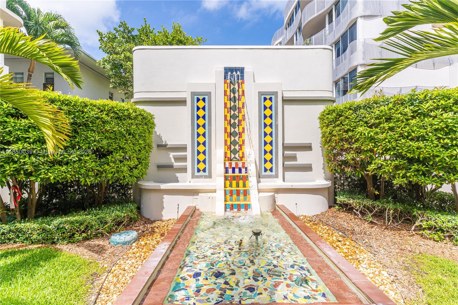435 21st Street, Unit 322 Miami Beach, FL 33139 - Photo 20 of 41 a front view of a house with a yard