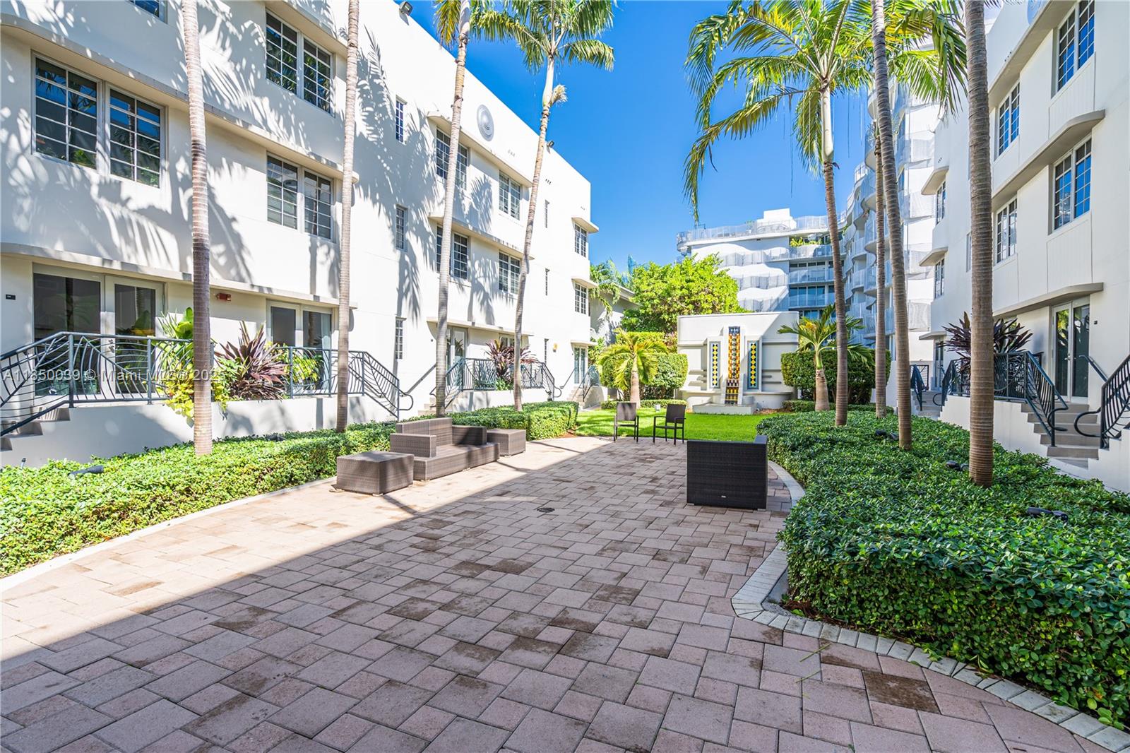 435 21st Street, Unit 322 Miami Beach, FL 33139 - Photo 22 of 41 a view of a building with garden and plants