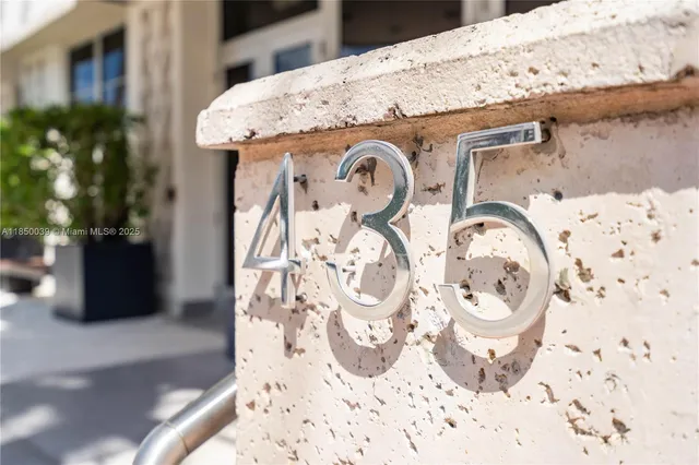 a view of a building with a palm tree