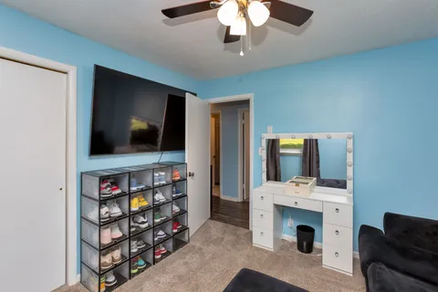 a living room with flat screen tv and a fireplace
