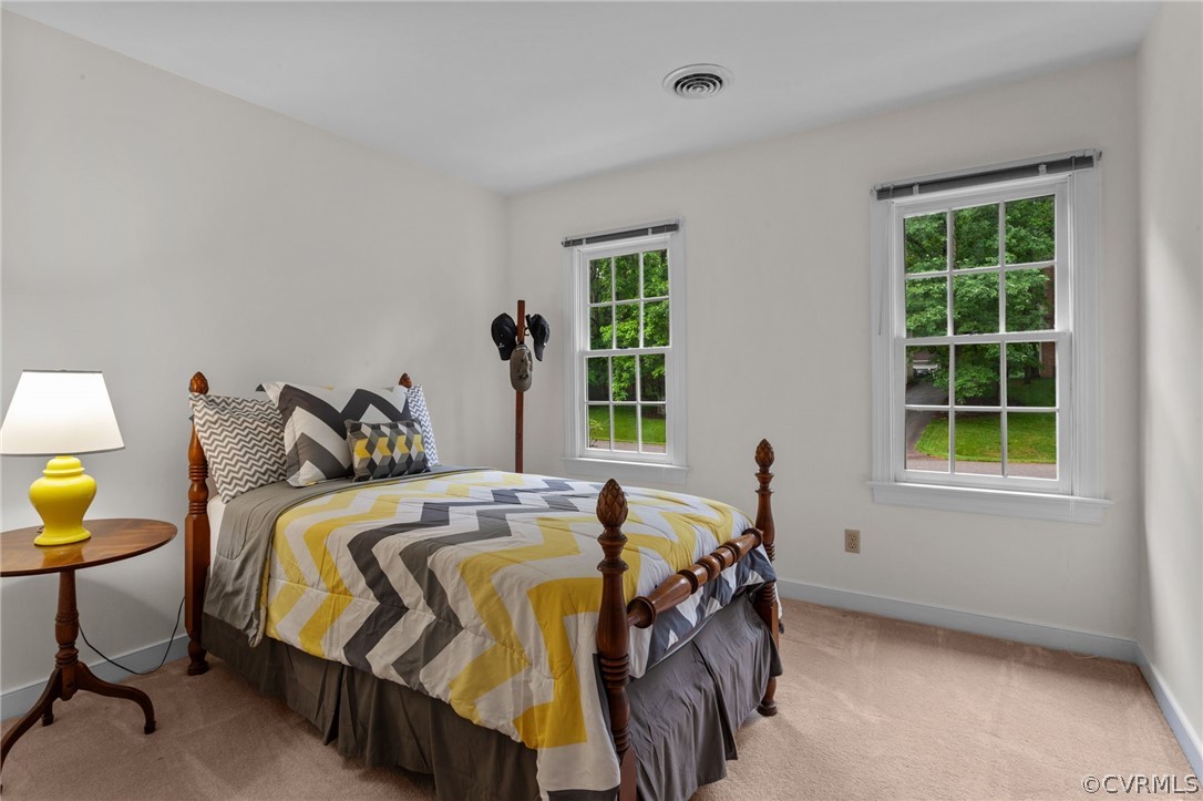 413 Lancey Drive Midlothian, VA 23114 - Photo 22 of 46 a bed sitting in a bedroom next to a window and work place