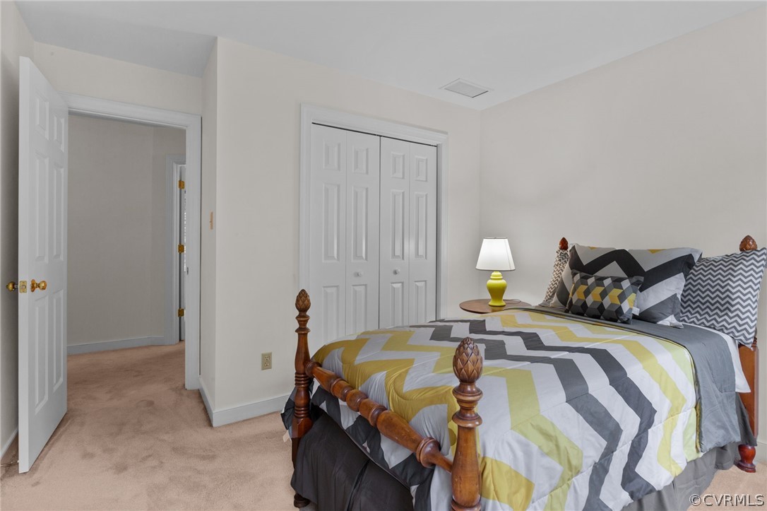 413 Lancey Drive Midlothian, VA 23114 - Photo 23 of 46 a bedroom with a bed and a cabinets