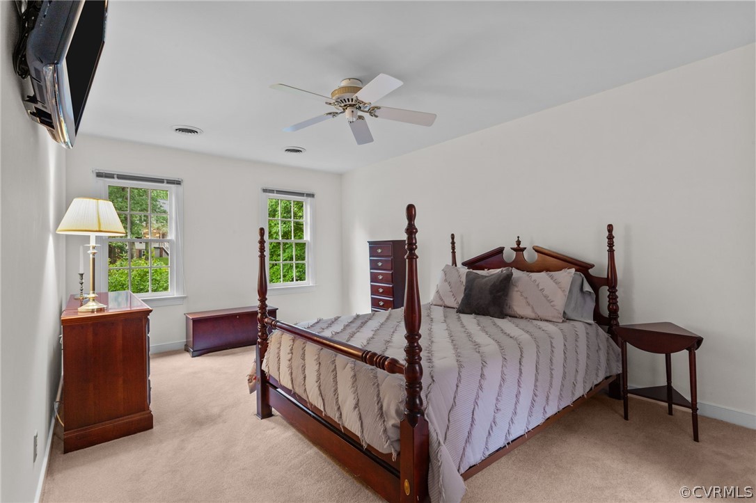 413 Lancey Drive Midlothian, VA 23114 - Photo 27 of 46 a bedroom with a bed and a dresser in it