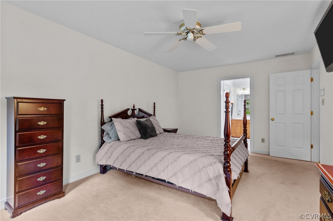 413 Lancey Drive Midlothian, VA 23114 - Photo 28 of 46 a bedroom with a bed and a chandelier