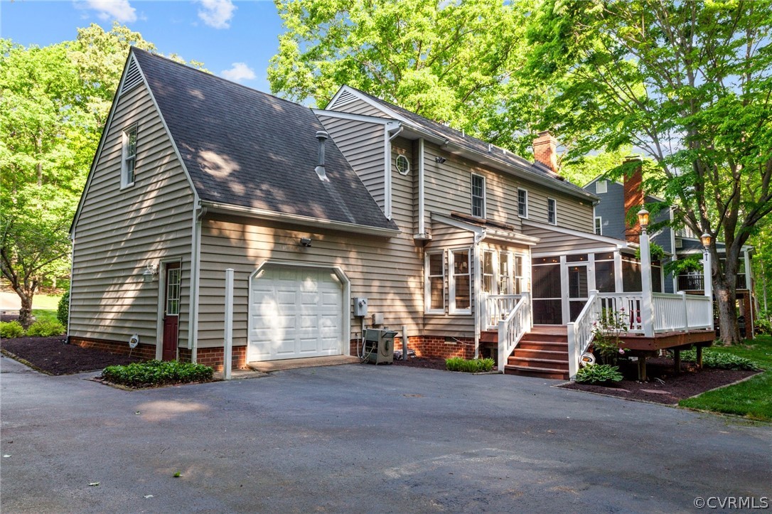 413 Lancey Drive Midlothian, VA 23114 - Photo 31 of 46 a front view of a house with a yard and garage