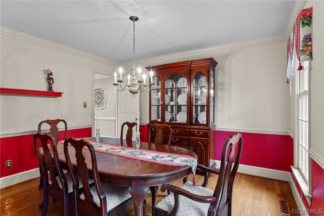 413 Lancey Drive Midlothian, VA 23114 - Photo 8 of 46 a view of a dining room with furniture and chandelier