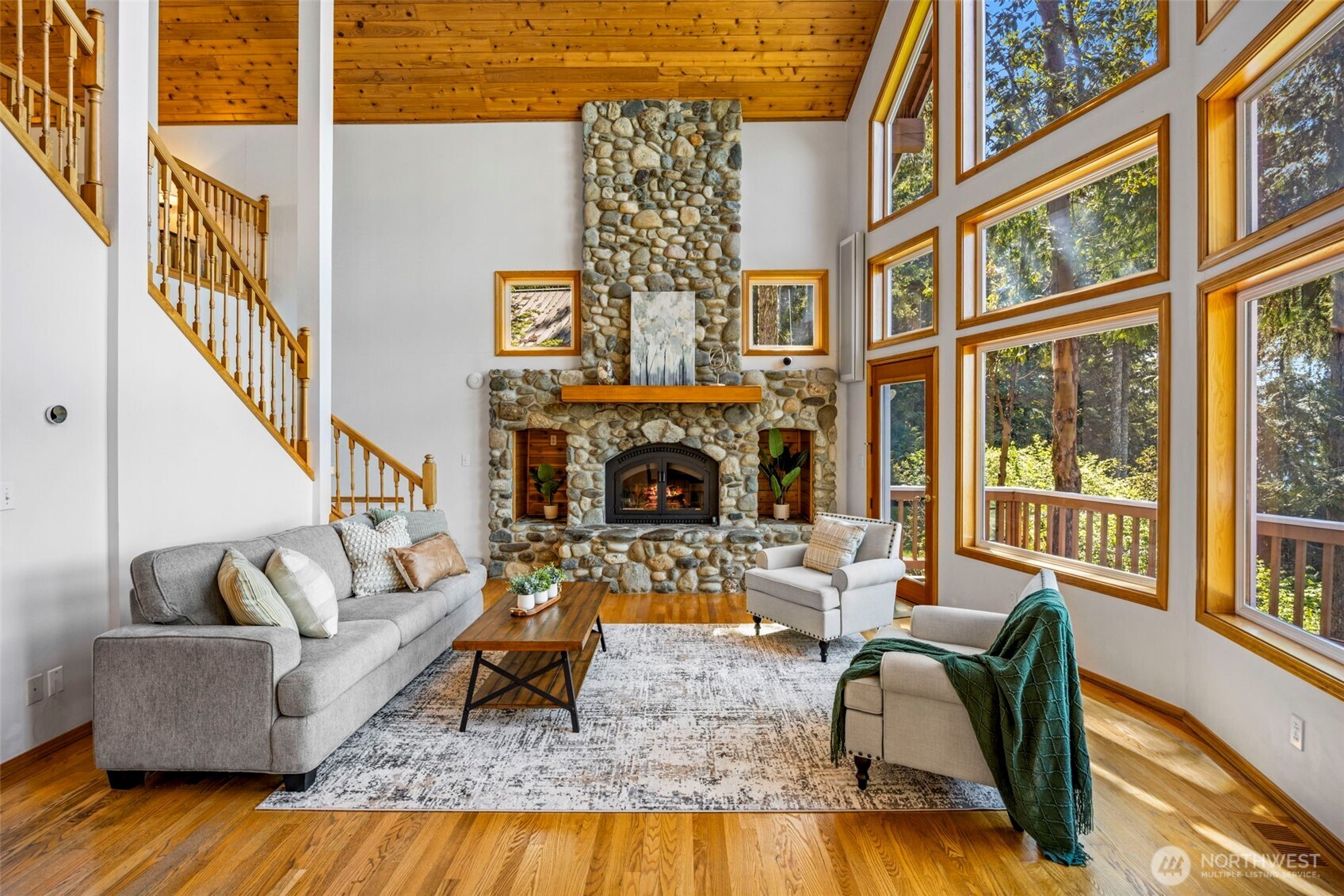 19736 Northwest Stavis Bay Road Seabeck, WA 98380 - Photo 18 of 39 a living room with fireplace furniture and a fireplace