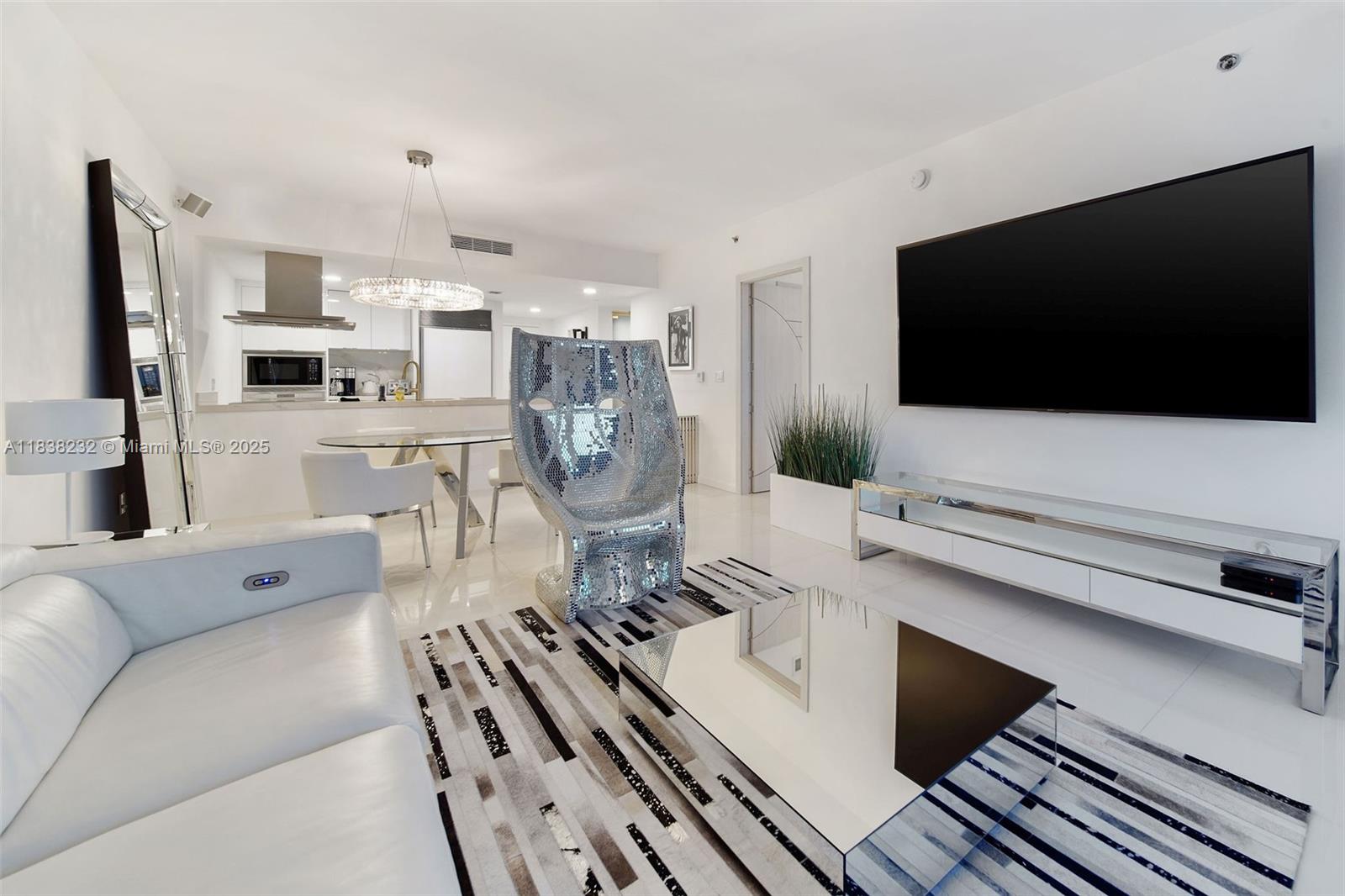 495 Brickell Avenue, Unit 4209 Miami, FL 33131 - Photo 16 of 37 a living room with furniture and a flat screen tv