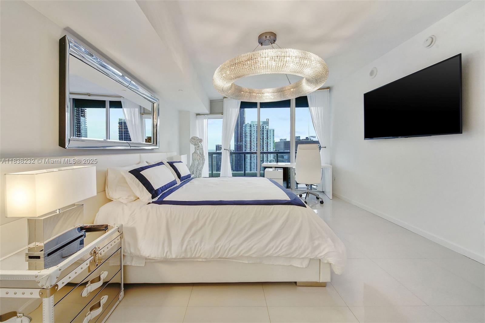 495 Brickell Avenue, Unit 4209 Miami, FL 33131 - Photo 20 of 37 a bedroom with a bed and a flat screen tv