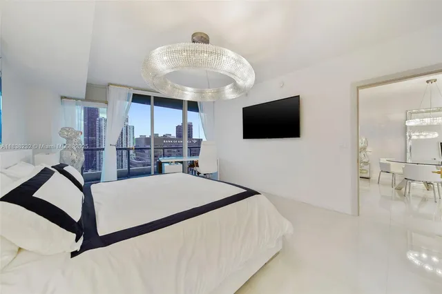 a bathroom with a double vanity sink mirror and a toilet