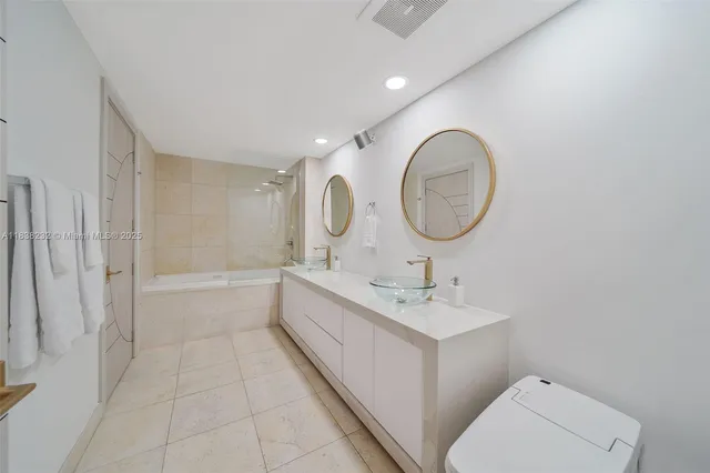 a bathroom with a double vanity sink and a mirror