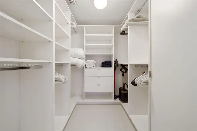 a view of a storage and utility room with a washer and dryer