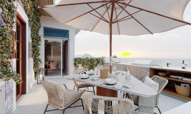 a patio with a table and chairs