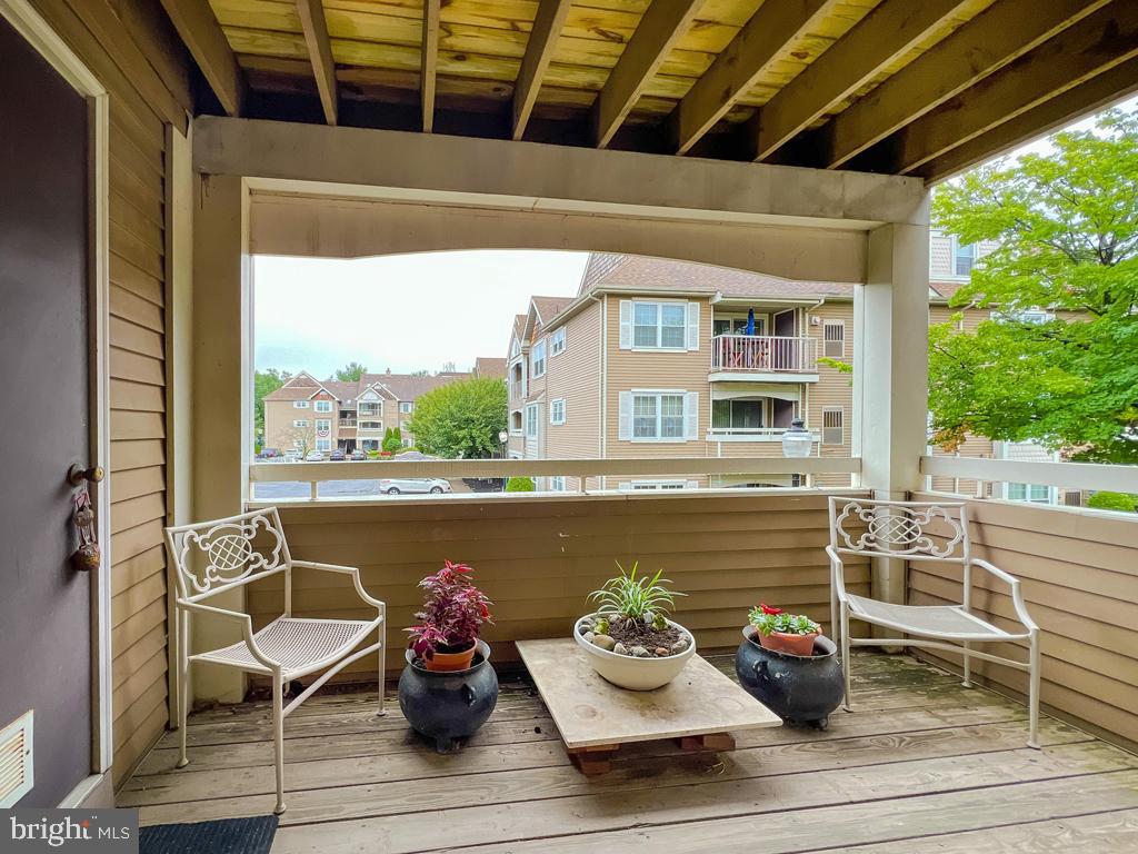 72203 Delaire Landing Road, Unit 203 Philadelphia, PA 19114 - Photo 23 of 32 a view of a chairs and table on the deck
