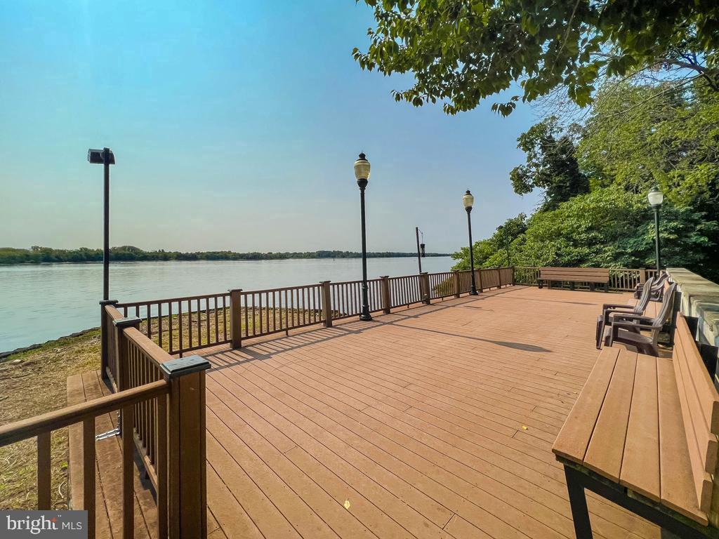 72203 Delaire Landing Road, Unit 203 Philadelphia, PA 19114 - Photo 27 of 32 a view of wooden deck with a lake view