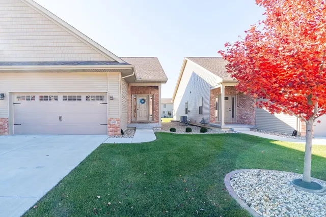 a view of a house with backyard and porch