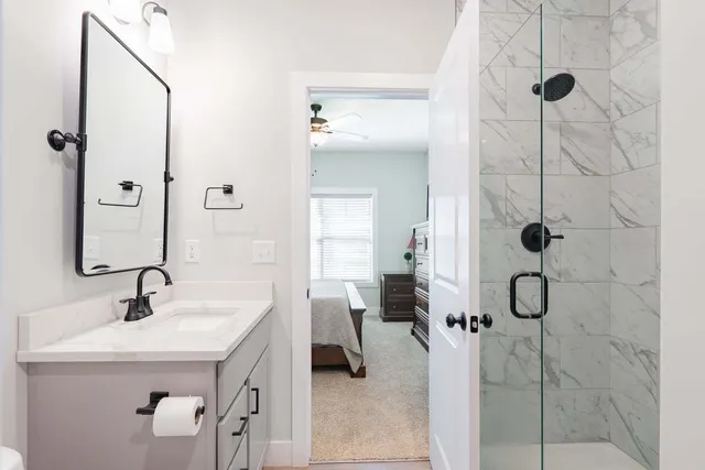 a bathroom with a sink and mirror