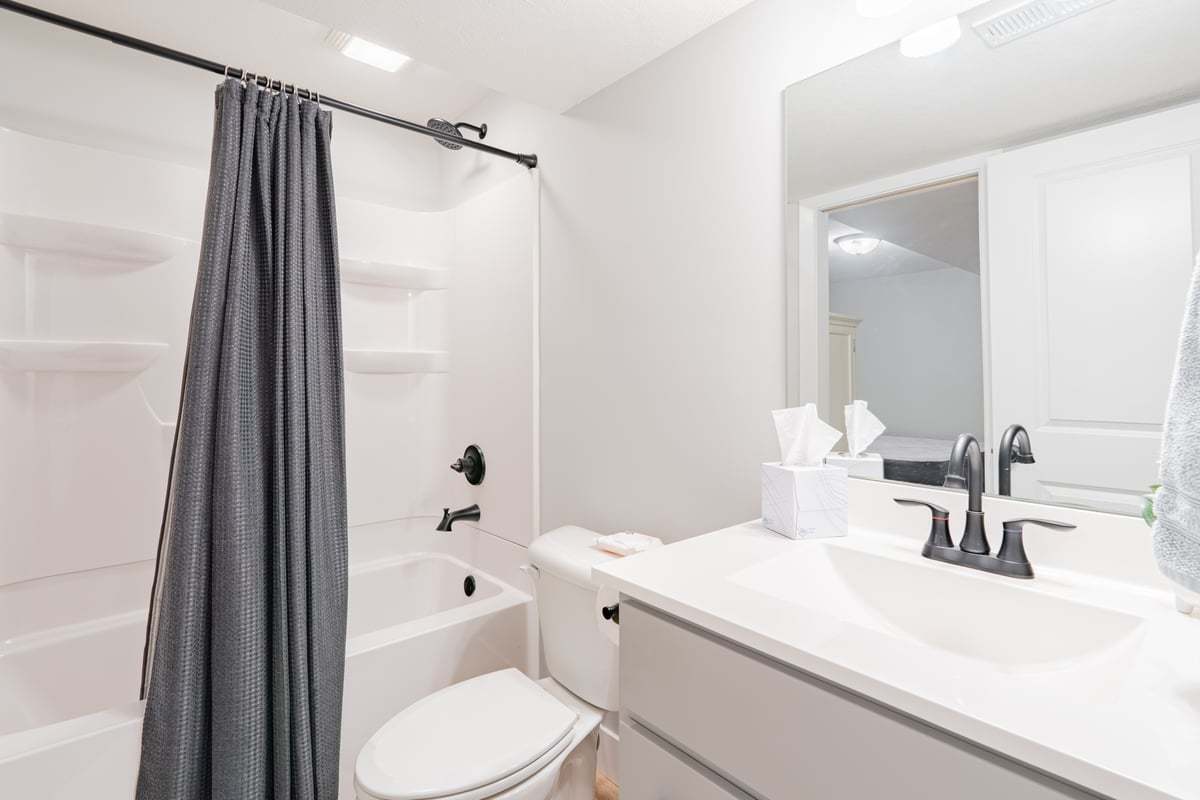 1809 Glenbridge Road Bloomington, IL 61704 - Photo 17 of 23 a bathroom with a sink a toilet and shower