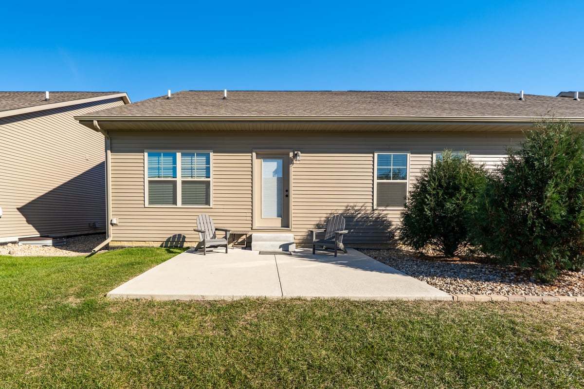 1809 Glenbridge Road Bloomington, IL 61704 - Photo 19 of 23 a backyard of a house with yard and outdoor seating