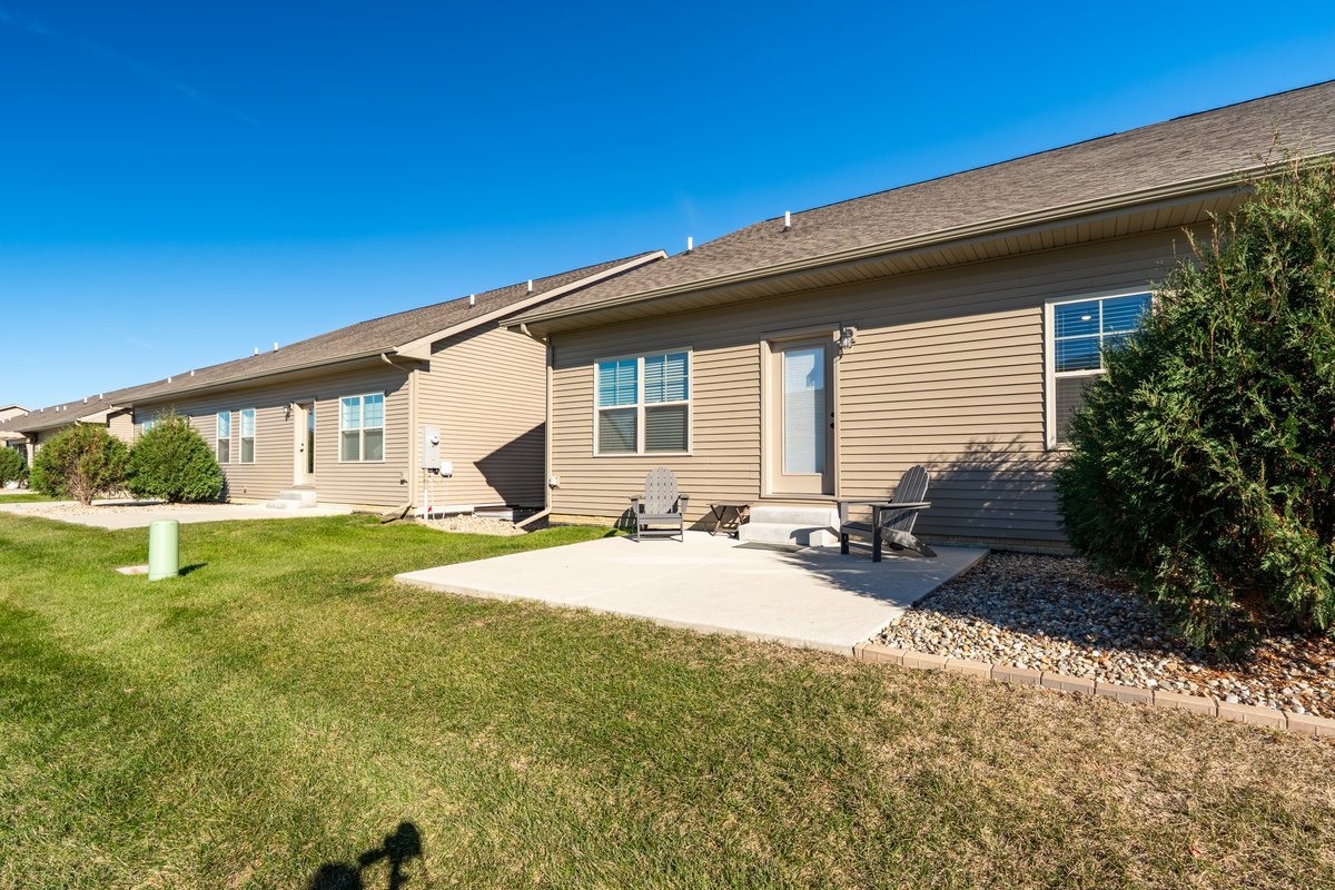 1809 Glenbridge Road Bloomington, IL 61704 - Photo 20 of 23 a backyard of a house with yard and outdoor seating