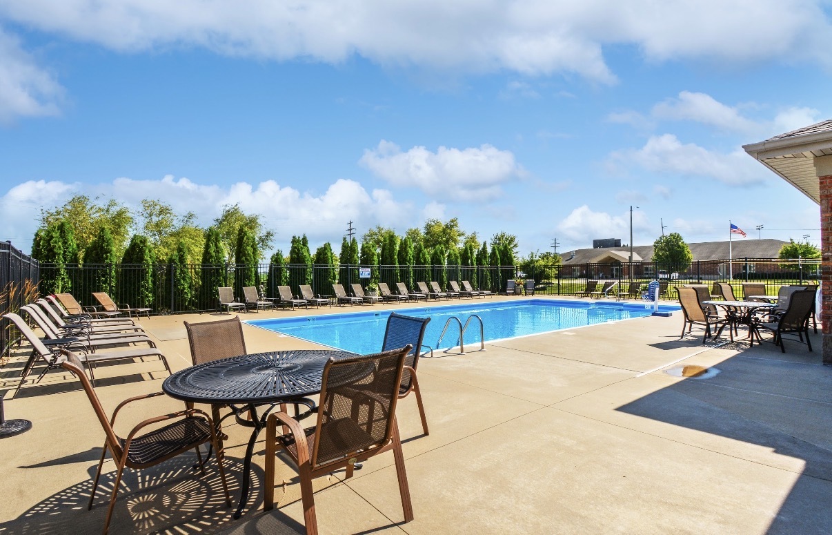 1809 Glenbridge Road Bloomington, IL 61704 - Photo 23 of 23 a view of a patio with a table and chairs