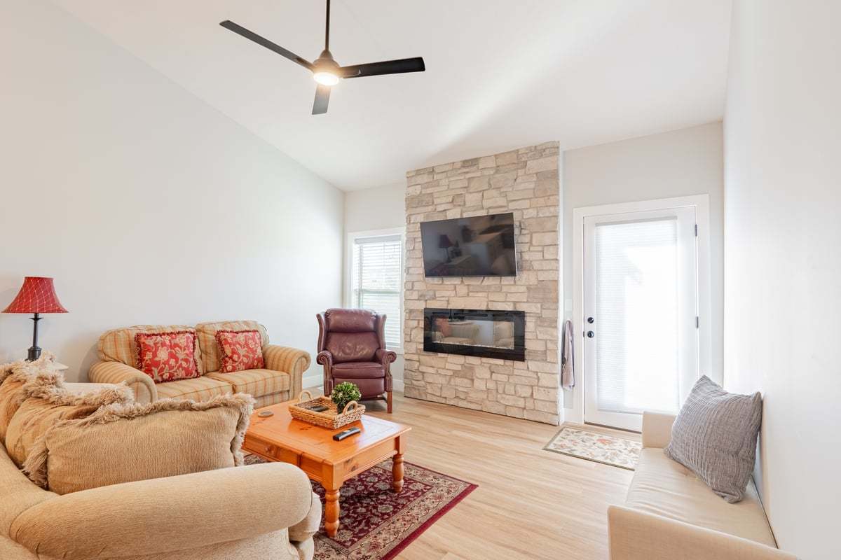 1809 Glenbridge Road Bloomington, IL 61704 - Photo 8 of 23 a living room with furniture and a fireplace