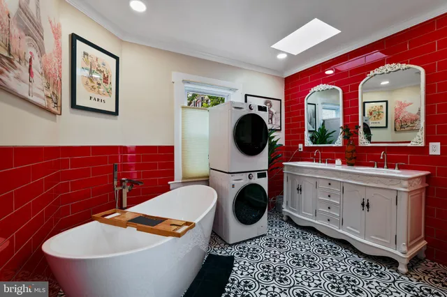 a bathroom with a toilet a sink and a mirror