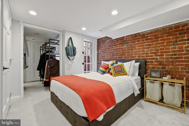 a bedroom with a bed and a walk in closet