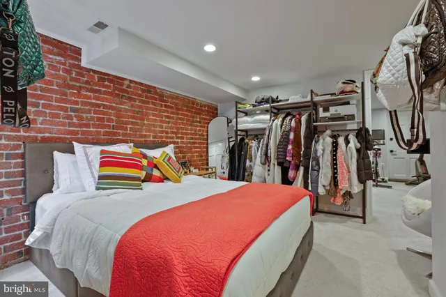 a bed room with a bed and a walk in closet