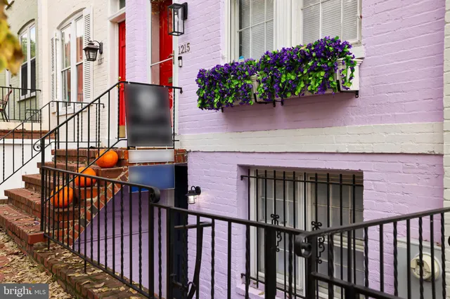 a view of a house with a flower garden