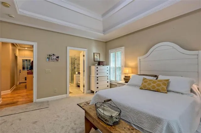 a bedroom with a bed and dresser