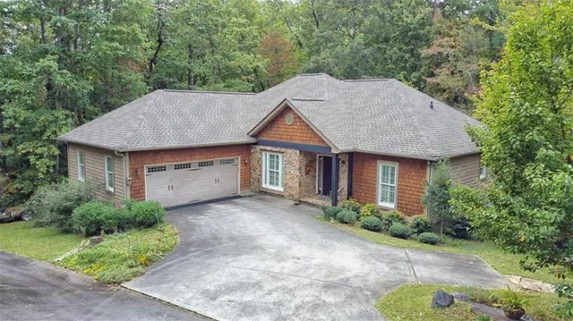a aerial view of a house with yard and plants