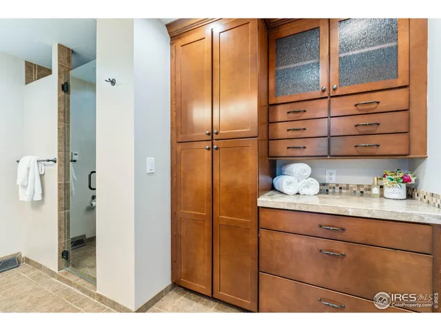 a kitchen with stainless steel appliances a refrigerator and cabinets