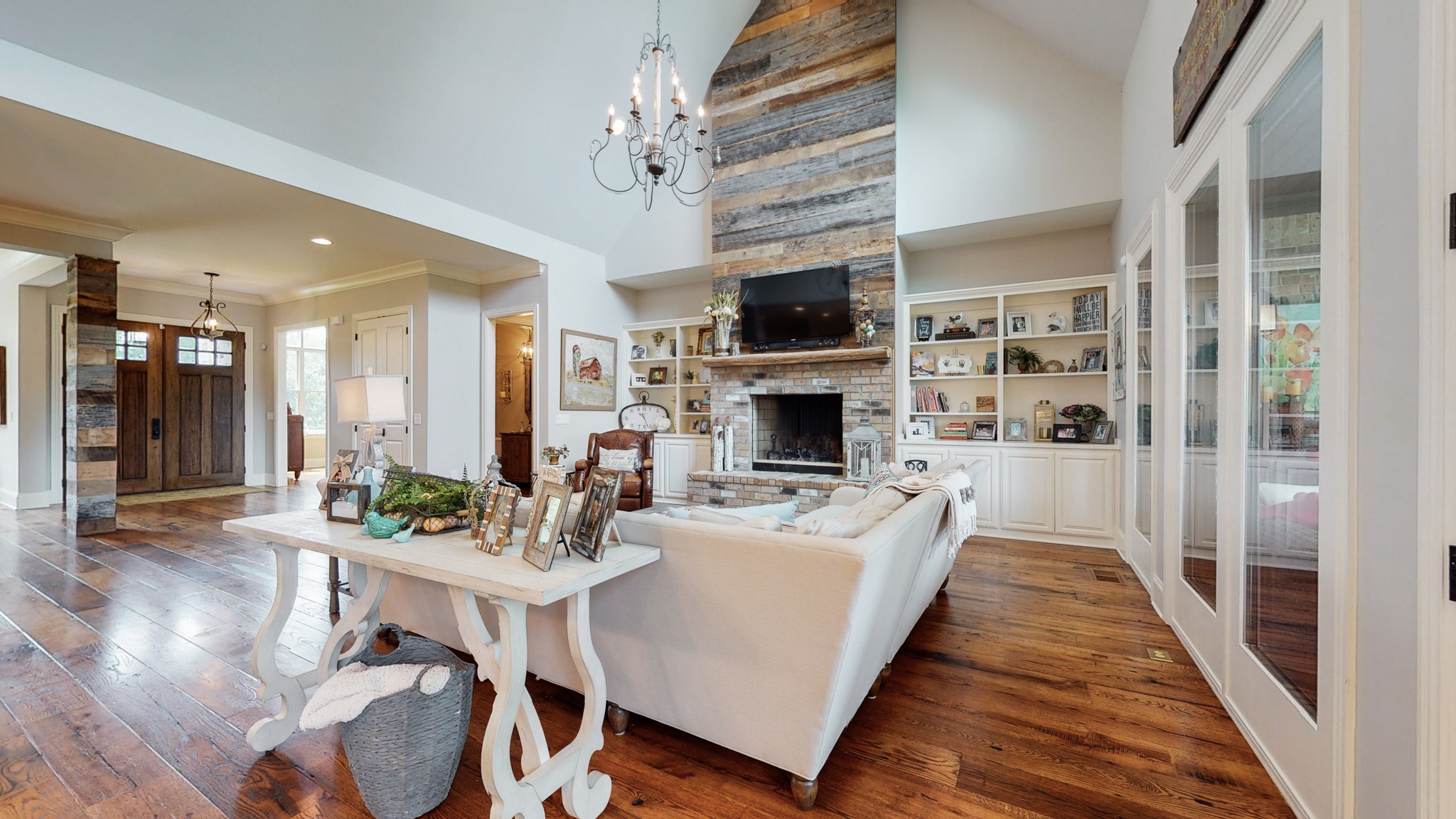 1110 Ridgeway Drive Franklin, TN 37067 - Photo 12 of 48 a living room with furniture a fireplace and a flat screen tv