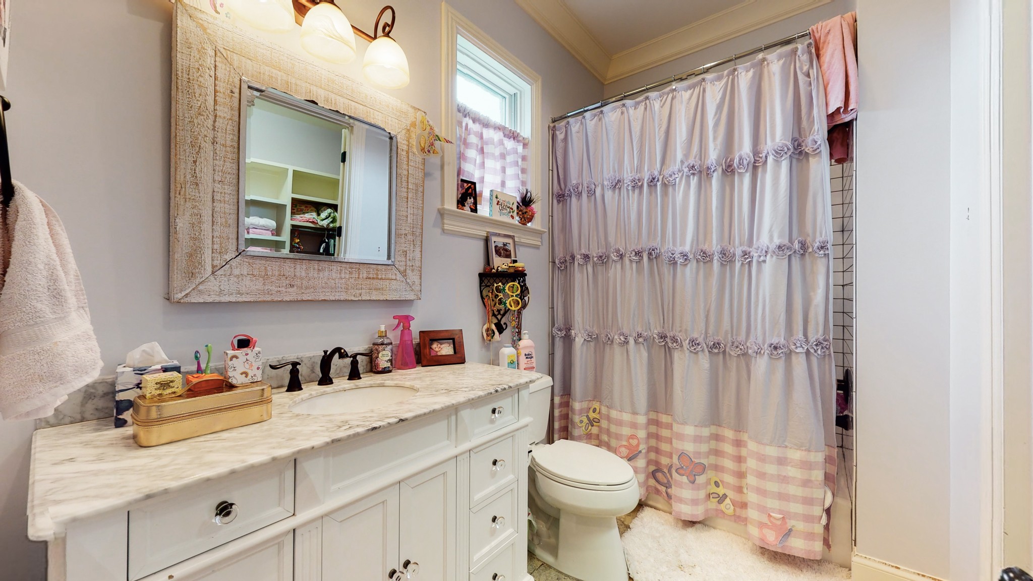 1110 Ridgeway Drive Franklin, TN 37067 - Photo 27 of 48 a bathroom with a sink a toilet and shower curtain
