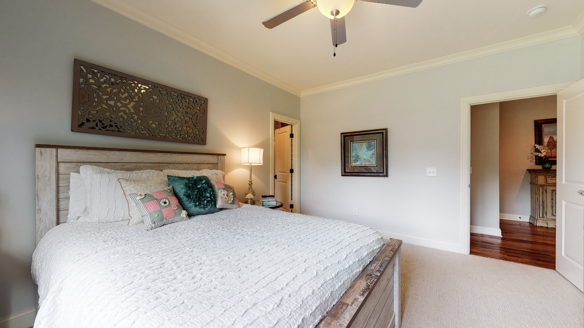 1110 Ridgeway Drive Franklin, TN 37067 - Photo 31 of 48 a bedroom with a large bed and a chandelier